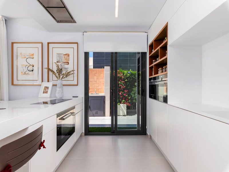 Modern white kitchen with direct garden access